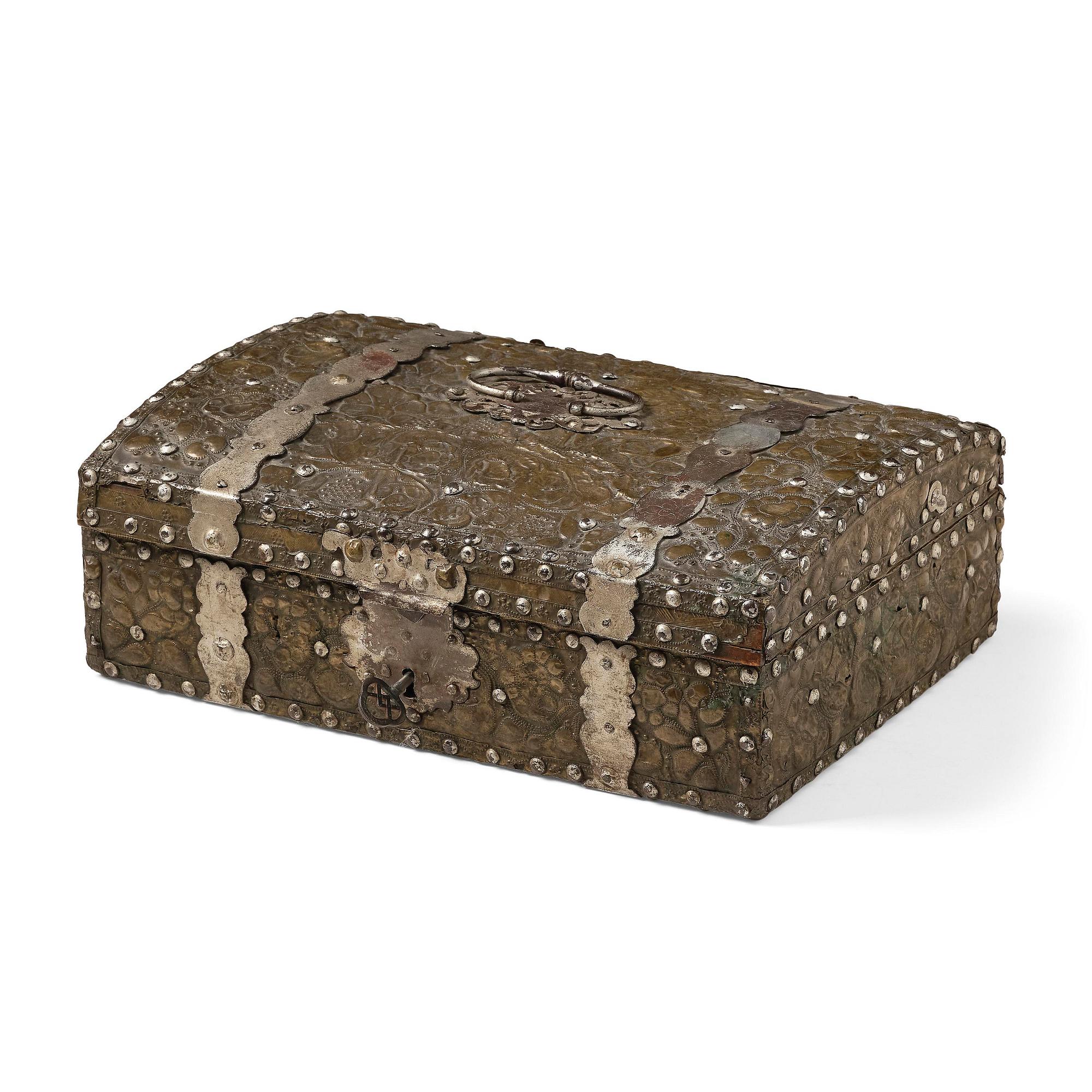 A presumably German baroque repoussé brass writing box, late 17th century.