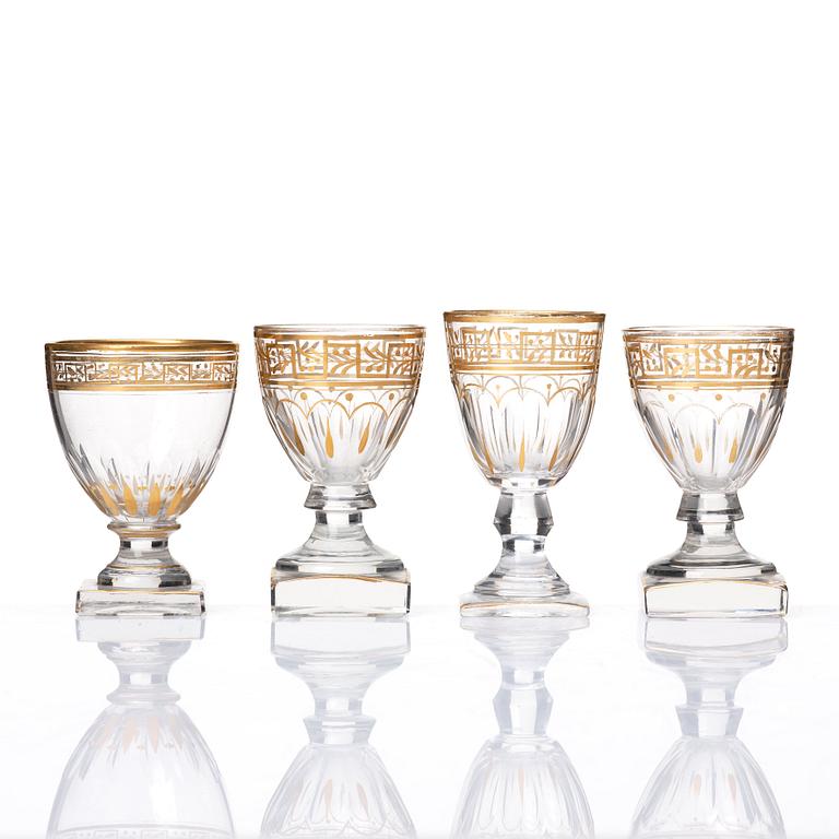 A set of Russian glasses (13 pcs.) and a bottle with stopper, 19th Century.