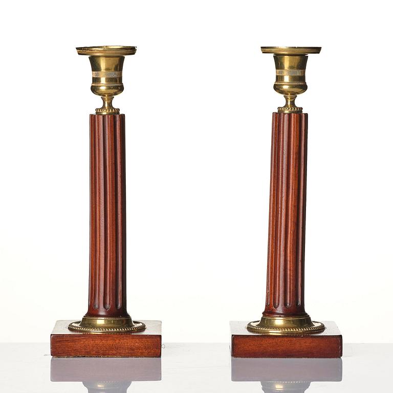 A pair of late Gustavian mahogany and gilt-brass candlesticks, late 18th century.