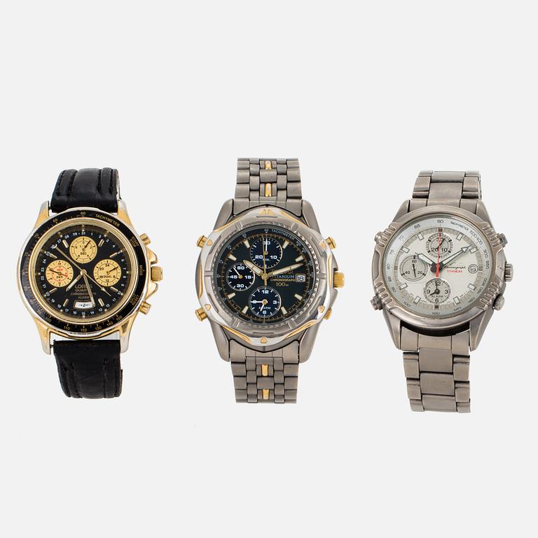 A set of three wristwatches.