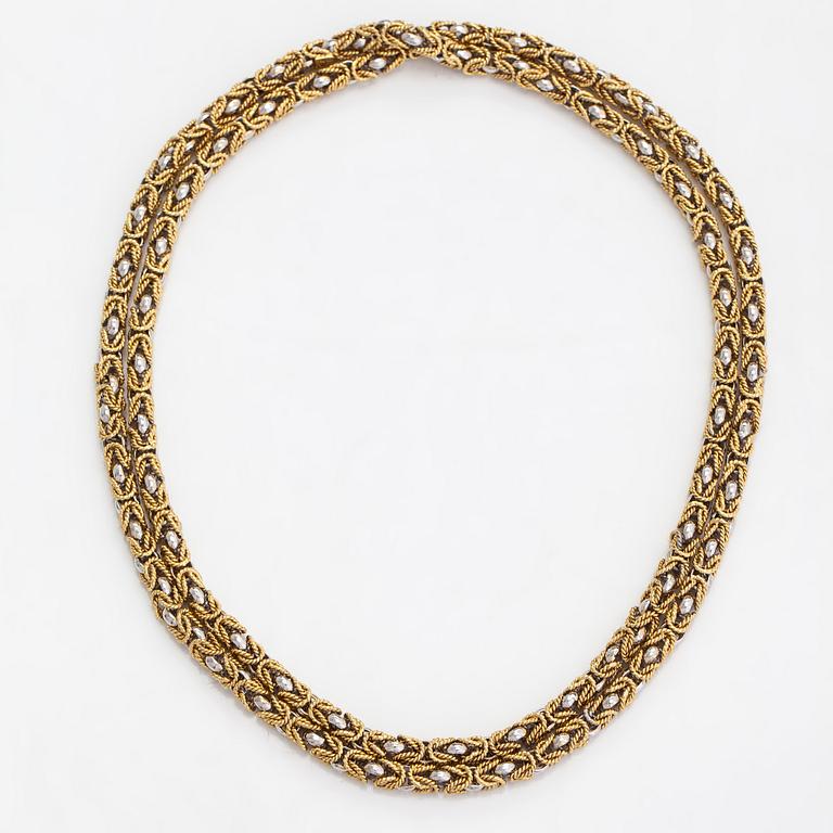 An 18K white and yellow gold necklace. Switzerland.