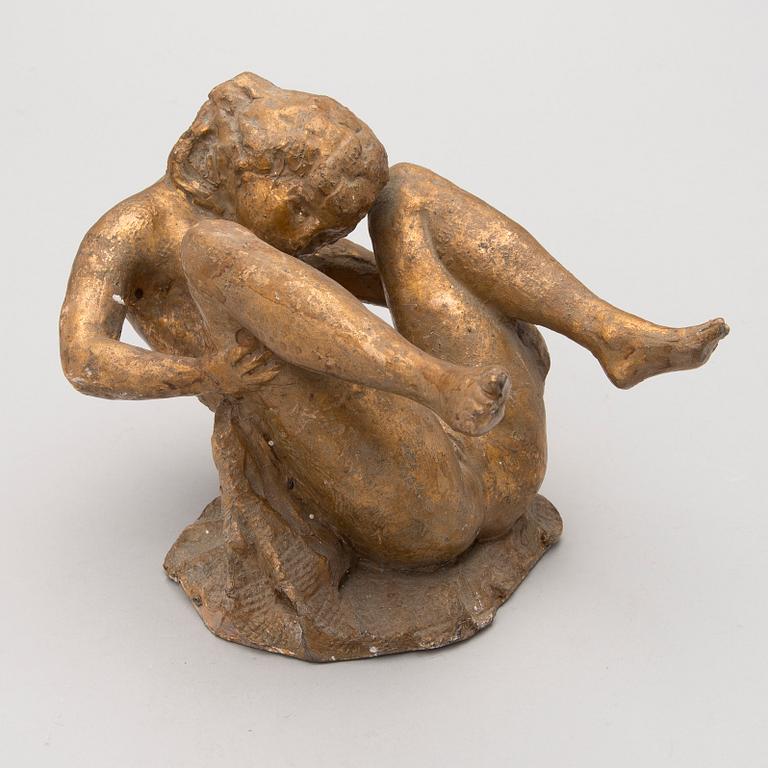 A gilt terracotta sculpture signed Matti Haupt.