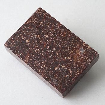 A Swedish porphyry 19th century paper weight.