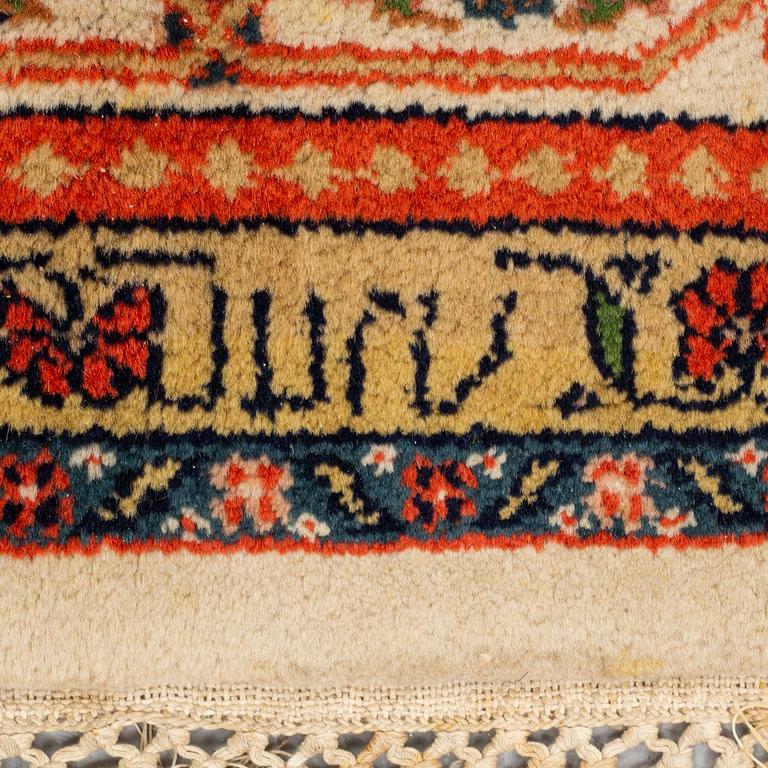 A rug, Old Tabriz, signed, ca 247 x 173 cm.