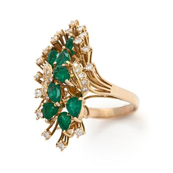 A 14K gold ring, with pear-cut emeralds and brilliant-cut diamonds totalling approximately 0.57 ct.