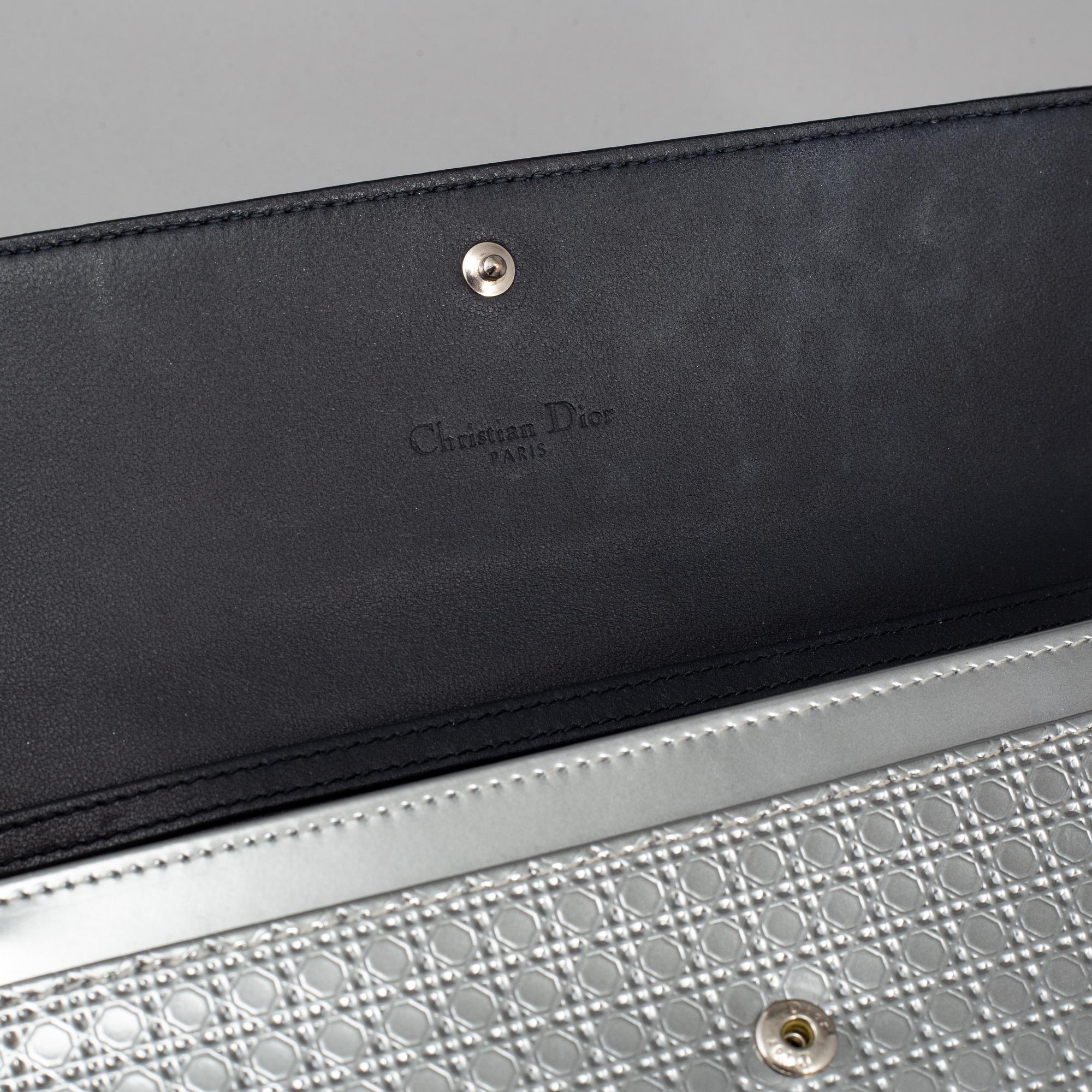 CHRISTIAN DIOR, an embossed metallic leather 'Wallet on Chain' clutch.