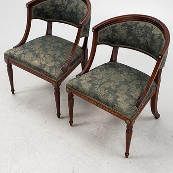A pair of Gustavian style armrest chairs, second half of the 20th century.
