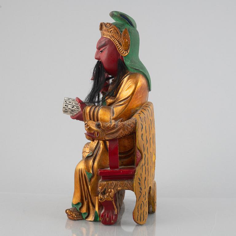 A Chinese lacquered wood figure, 20th century.