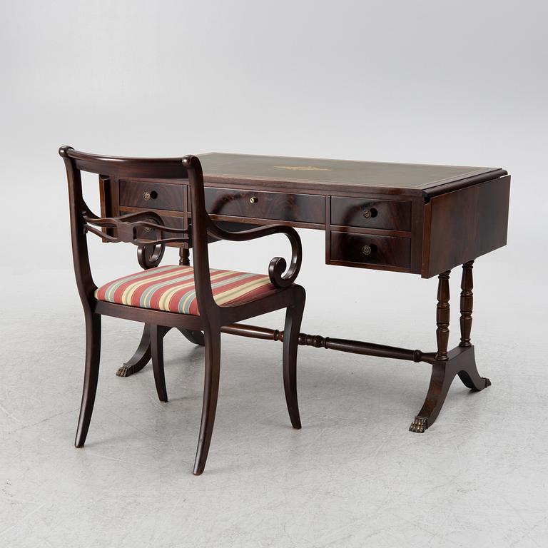 A mahogany veneer desk with desk chair, 20th Century.