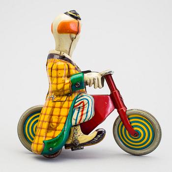 A tinplate Technofix bicycling clown Germany c. 1950.