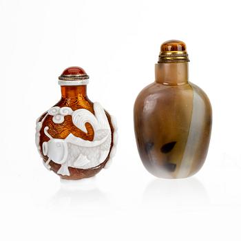 A set of two Chinese 20th century glass and agate snuff bottles.