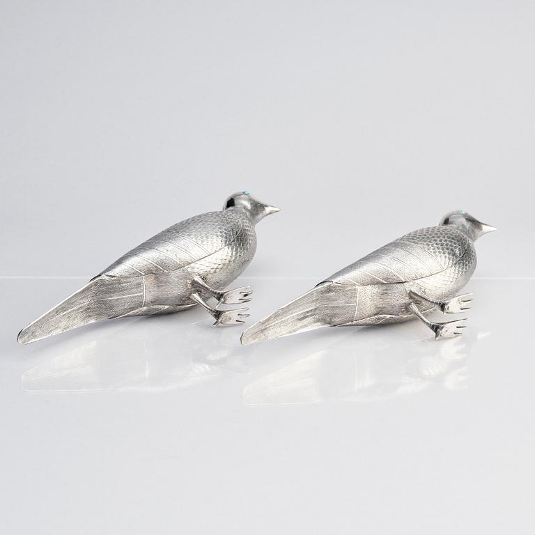 A pair of persian silver pigeons, the Qajar dynasty (1789–1925).