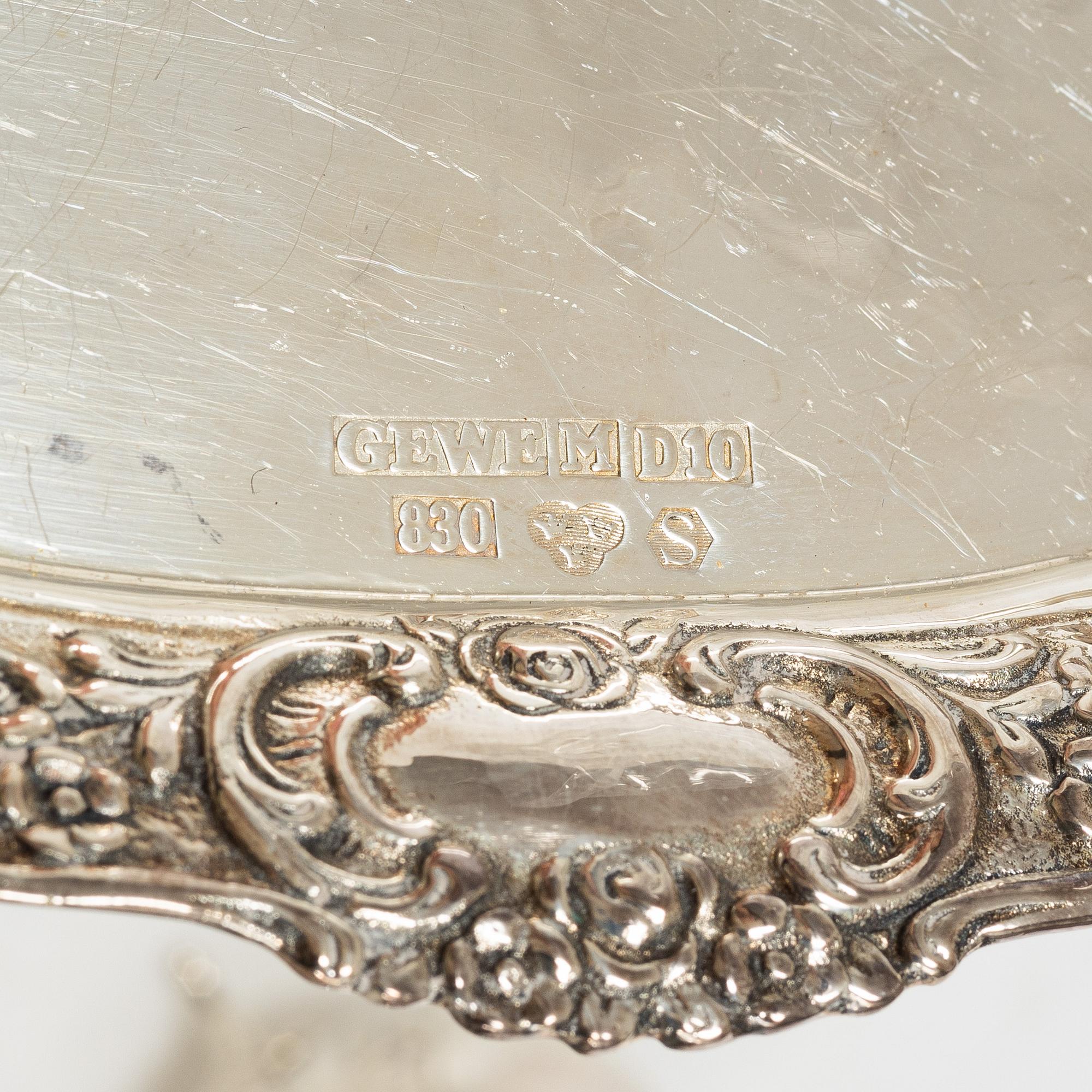 A Swedish silver Rococo style 4-piece coffee service, mark of Gewe, Malmö 1962-1978, and sugar tongs, Mylius, Norway.