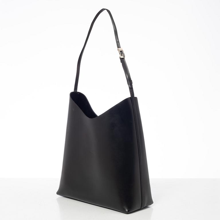 Gucci, A black leather bag.