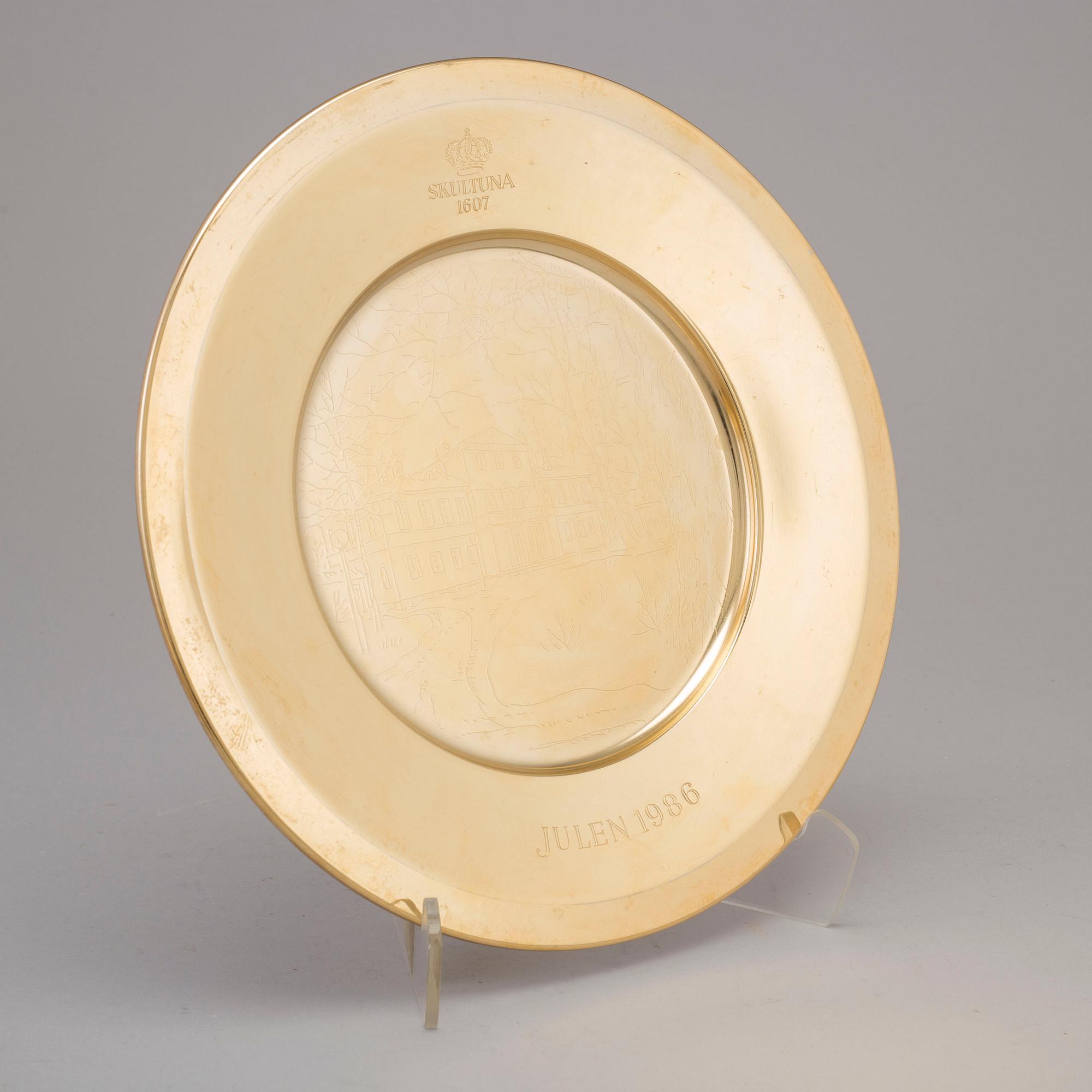 12 brass plates from Skultuna, late 20th century.