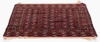 An antique Yomut rug, Western Turkmenistan, c. 119 x 104 cm.