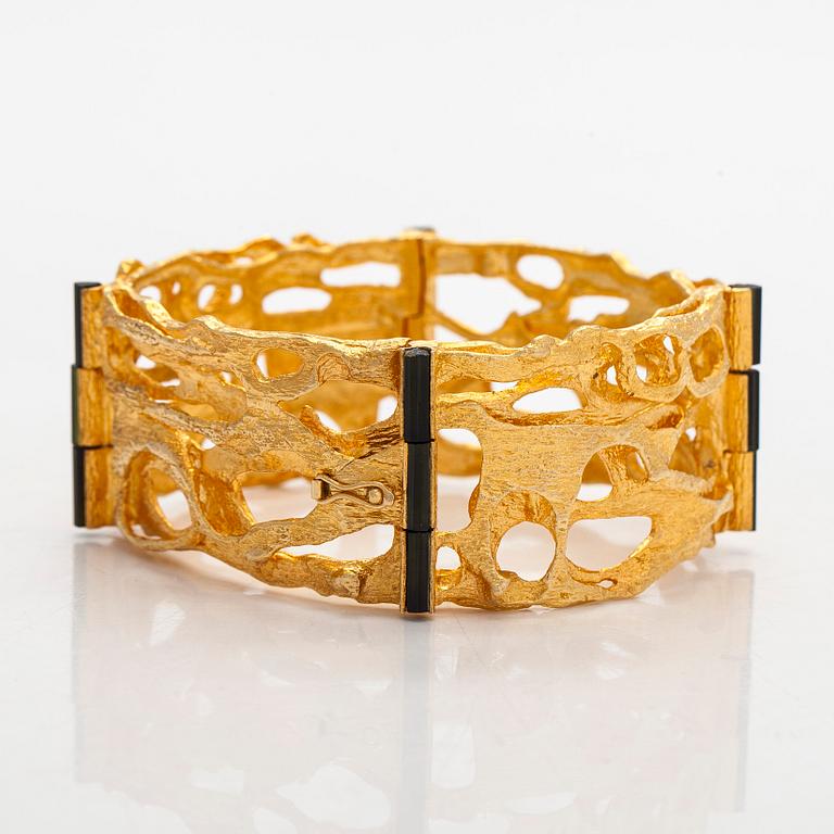 Björn Weckström, an 18K gold and tourmaline 'Sacrificial fire' bracelet. Lapponia 1971.