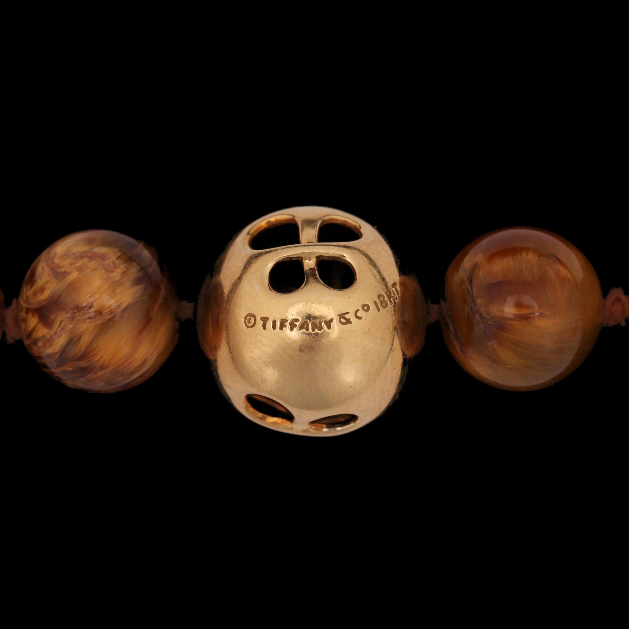 A Tiffany & Co Angela Cummings necklace with tigers eye quartz and gold clasp.