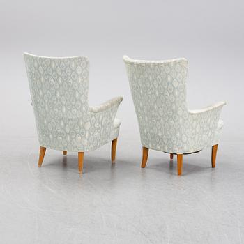 A pair of easy chairs by Carl Malmsten second half of the 20th Century.