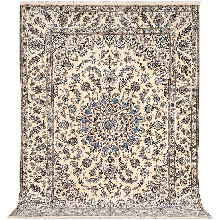 A Nain, part silk carpet, c. 337 x 244 cm.