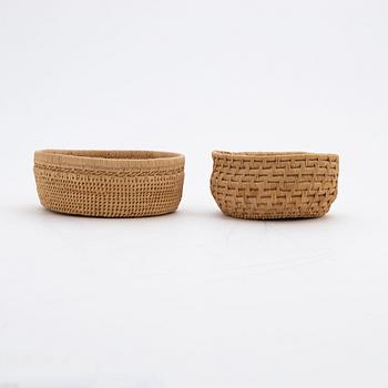 Two baskets and a brooch attributed to Ellen Kitok-Andersson.