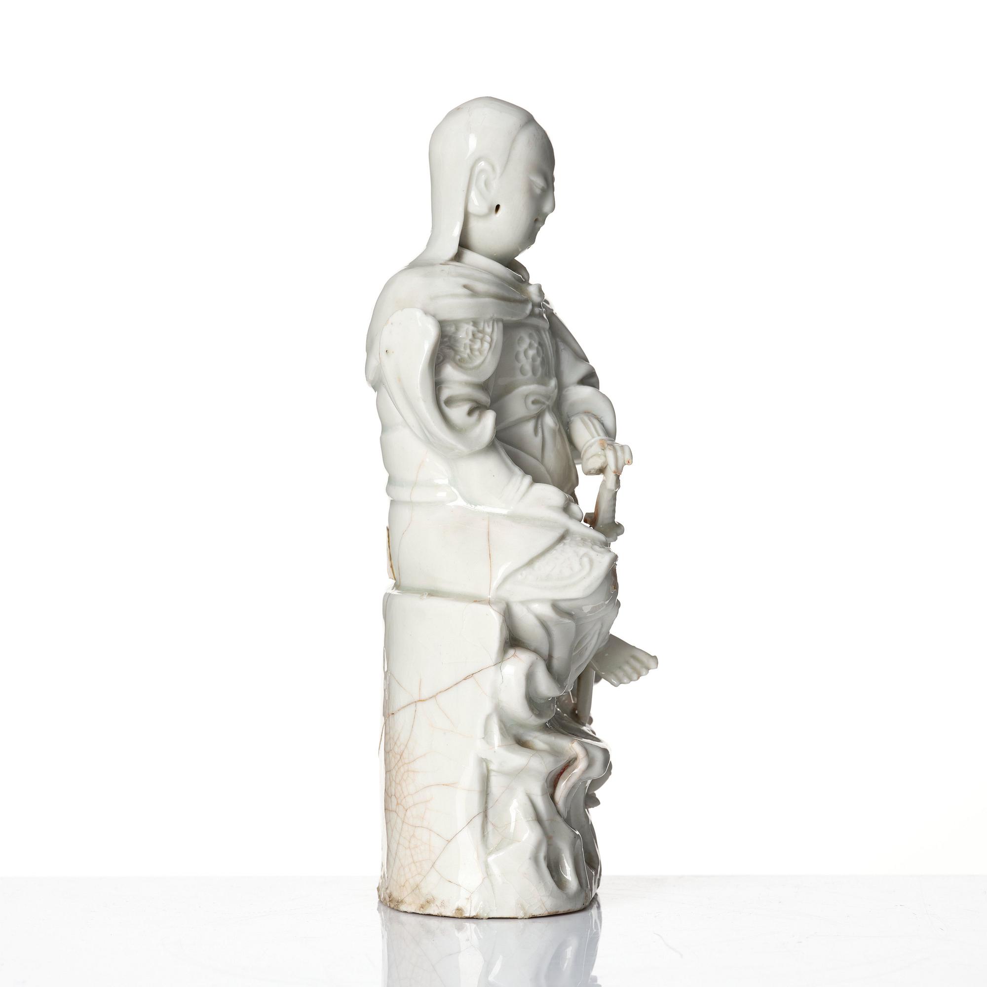 A Chinese blanc de chine/dehua figure of a Zhenwu, late Ming dynasty (17th century).