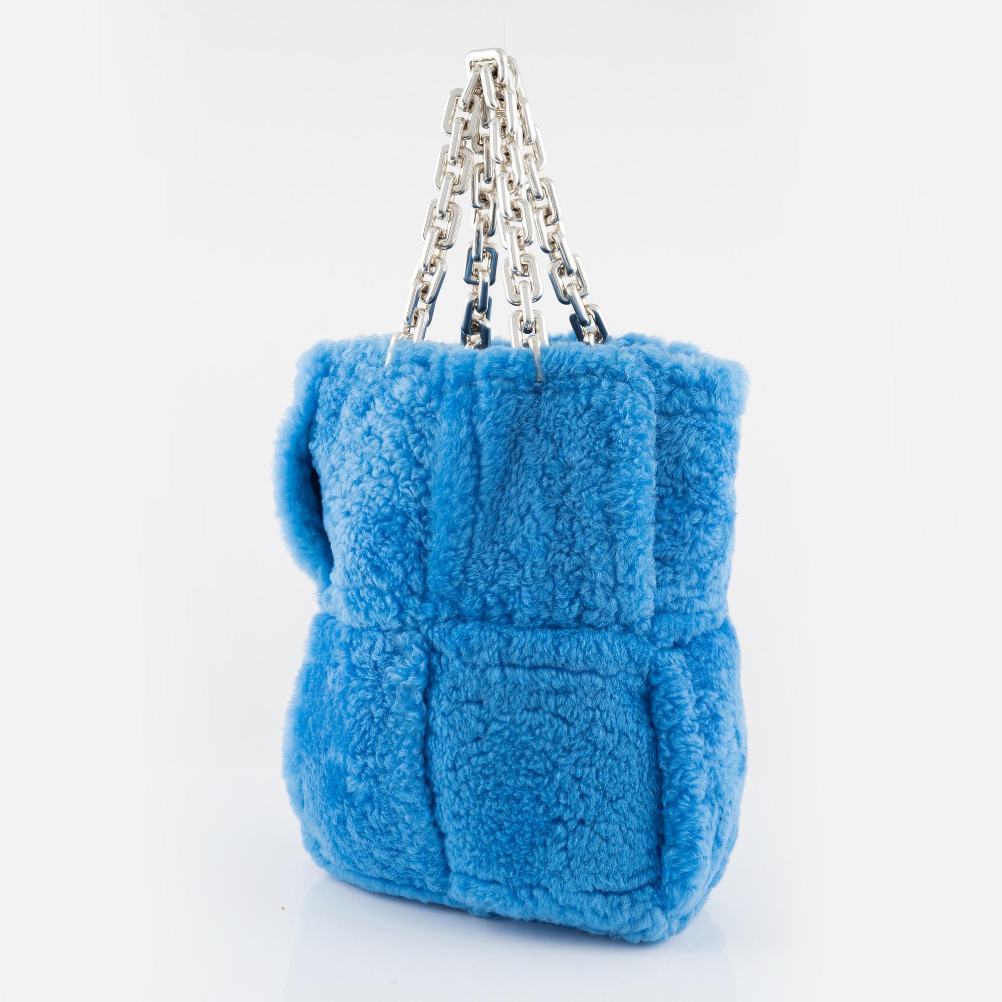 Bottega Veneta, A blue shearling intrecciato 'The Chain Tote'.