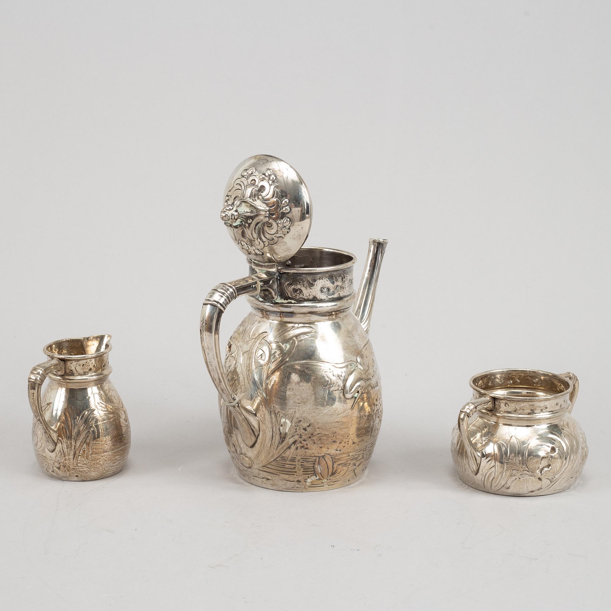 A Swedish silver coffee pot, creamer and sugar bowl, mark of Emil Oscar Möller, Malmö 1907.