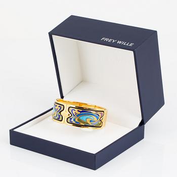 FREY WILLE, an enamel and gold plated metal bangle.