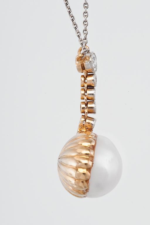 A DIAMOND AND PEARL PENDANT.