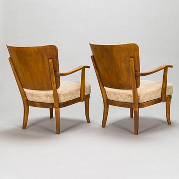 Einari Kyöstilä, a pair of 1940s open armchairs for Oy Stockmann Ab, Keravan Puusepäntehdas, Finland.
