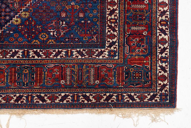 An oriental carpet, c. 360 x 270 cm.