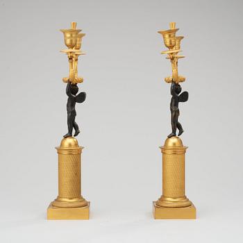 A pair of French Empire early 19th century two-light candelabra.