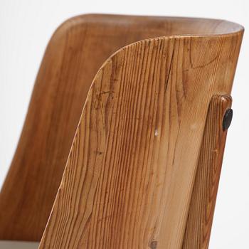 Axel Einar Hjorth, a pair of stained pine "Lovö" armchairs, Nordiska Kompaniet, Sweden, 1930s.