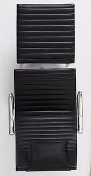 Charles & Ray Eames, an armchair and ottoman, Aluminium group model "EA 316", Vitra, 21st century.