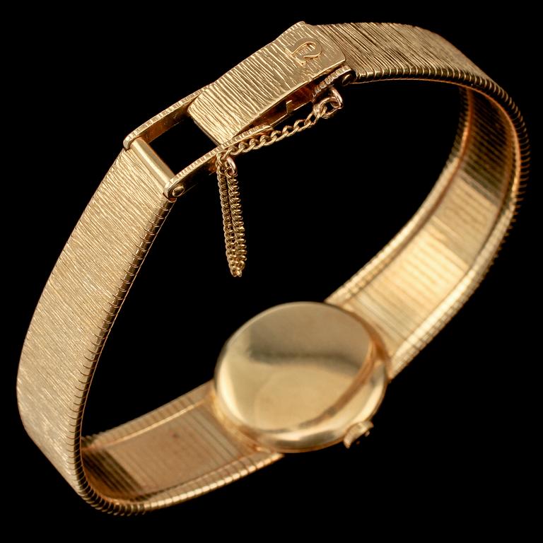 DAMARMBANDSUR, Omega, 18k guld, 1900-talets andra hälft. Vikt 39 g.