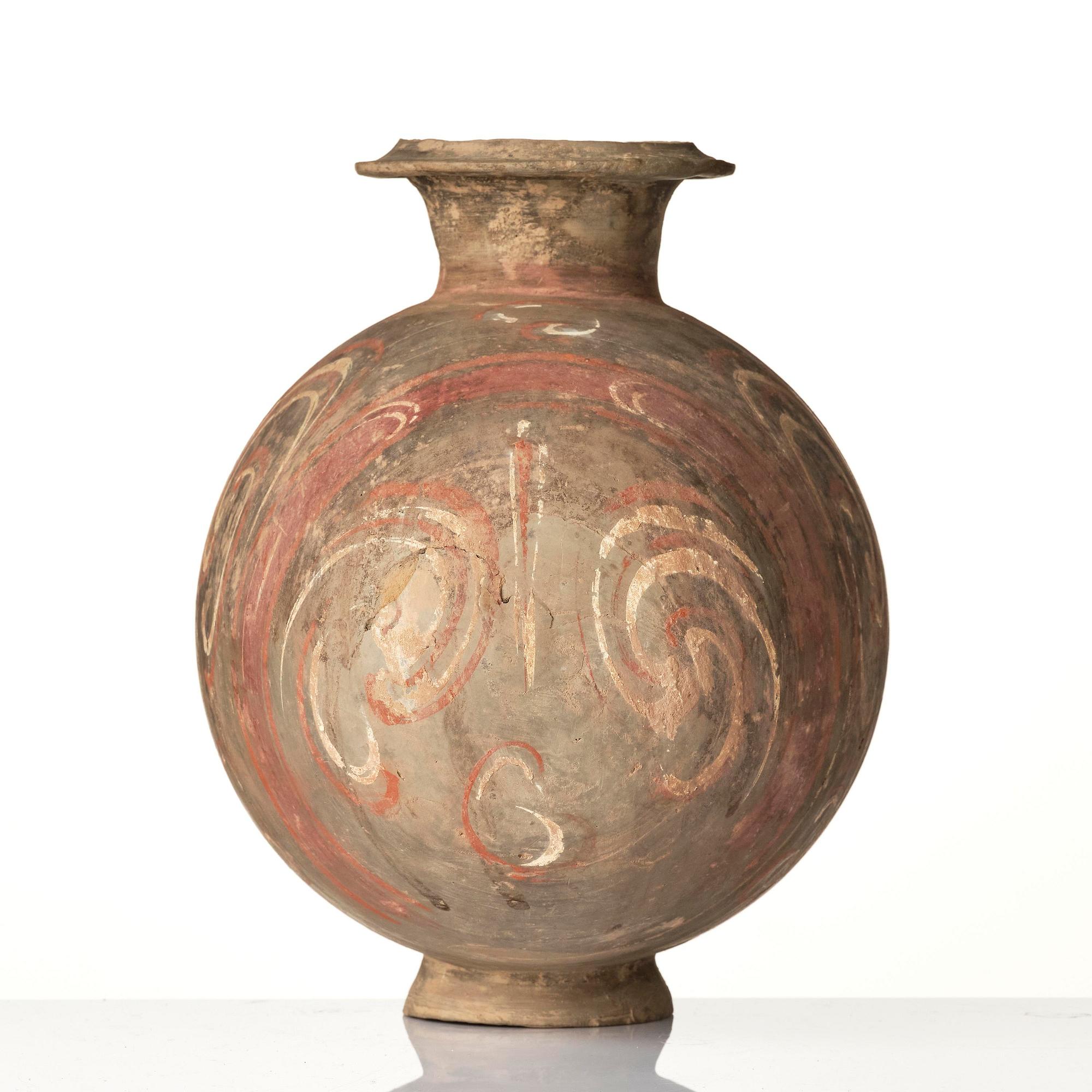 A well-painted dark grey pottery cocoon jar, 
Han dynasty (206 BC-AD 220).