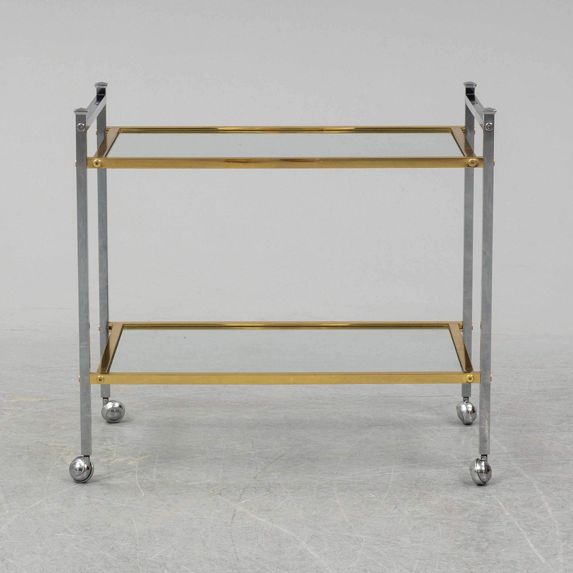 A metal and glass drinks trolley, 1970's/80's.