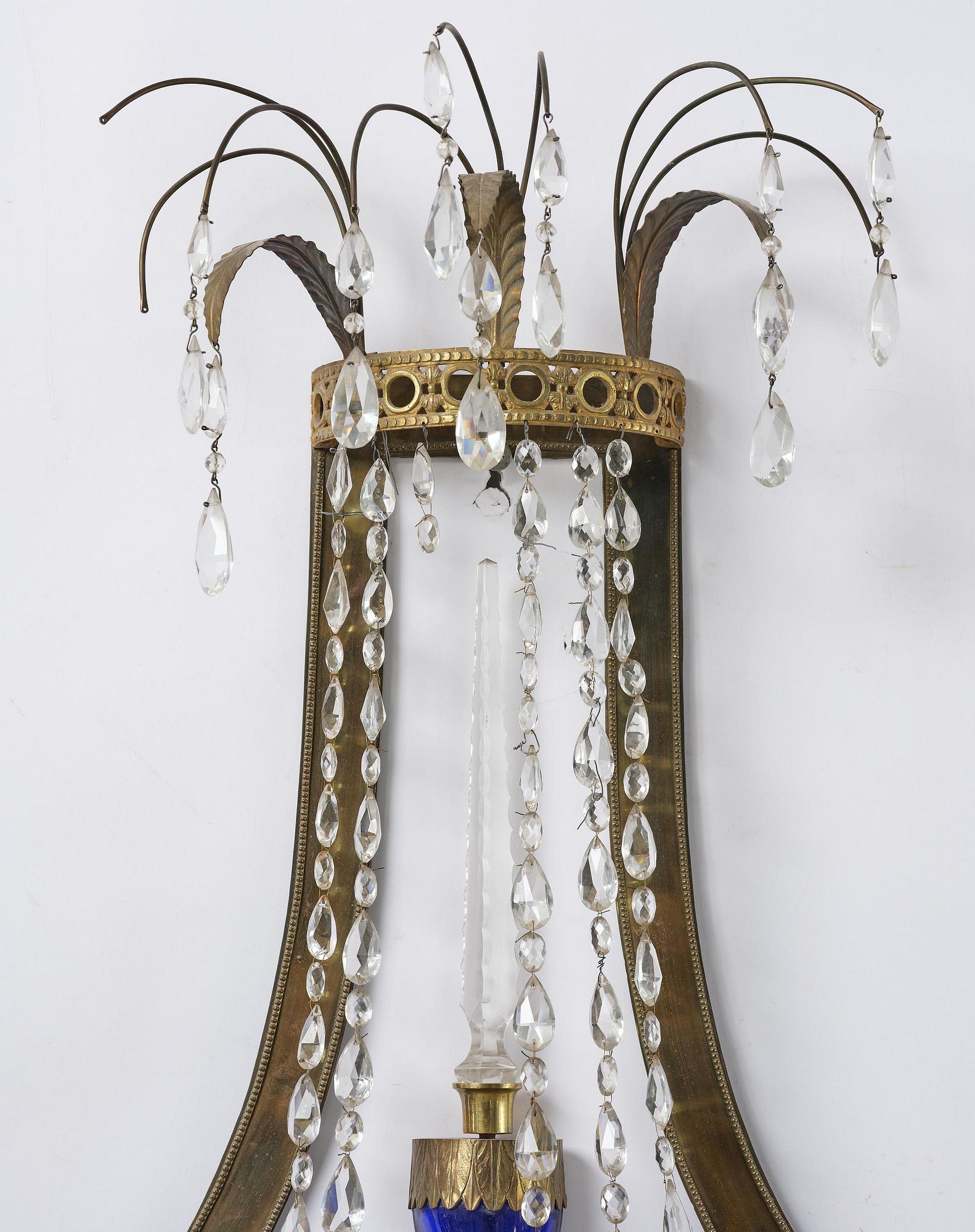 A pair of Russian Louis XVI-style  four-branch gilt bronze appliques, 19th century.
