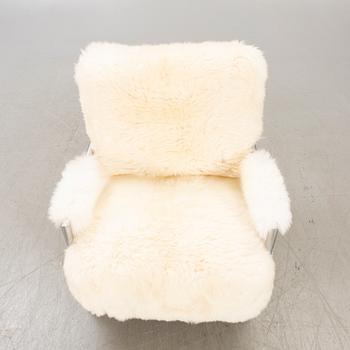 A 21st century Eilersen cheep skin armchair.