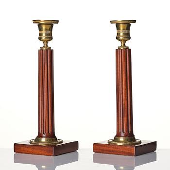 A pair of late Gustavian mahogany and gilt-brass candlesticks, late 18th century.