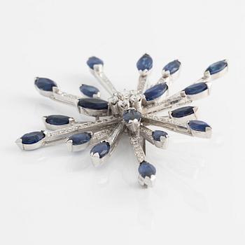 Brooch in 14K white gold with round brilliant, baguette, and navette-cut diamonds and navette-shaped sapphires.