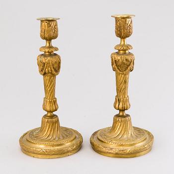 A pair of 19th century brass candlesticks, probably France.