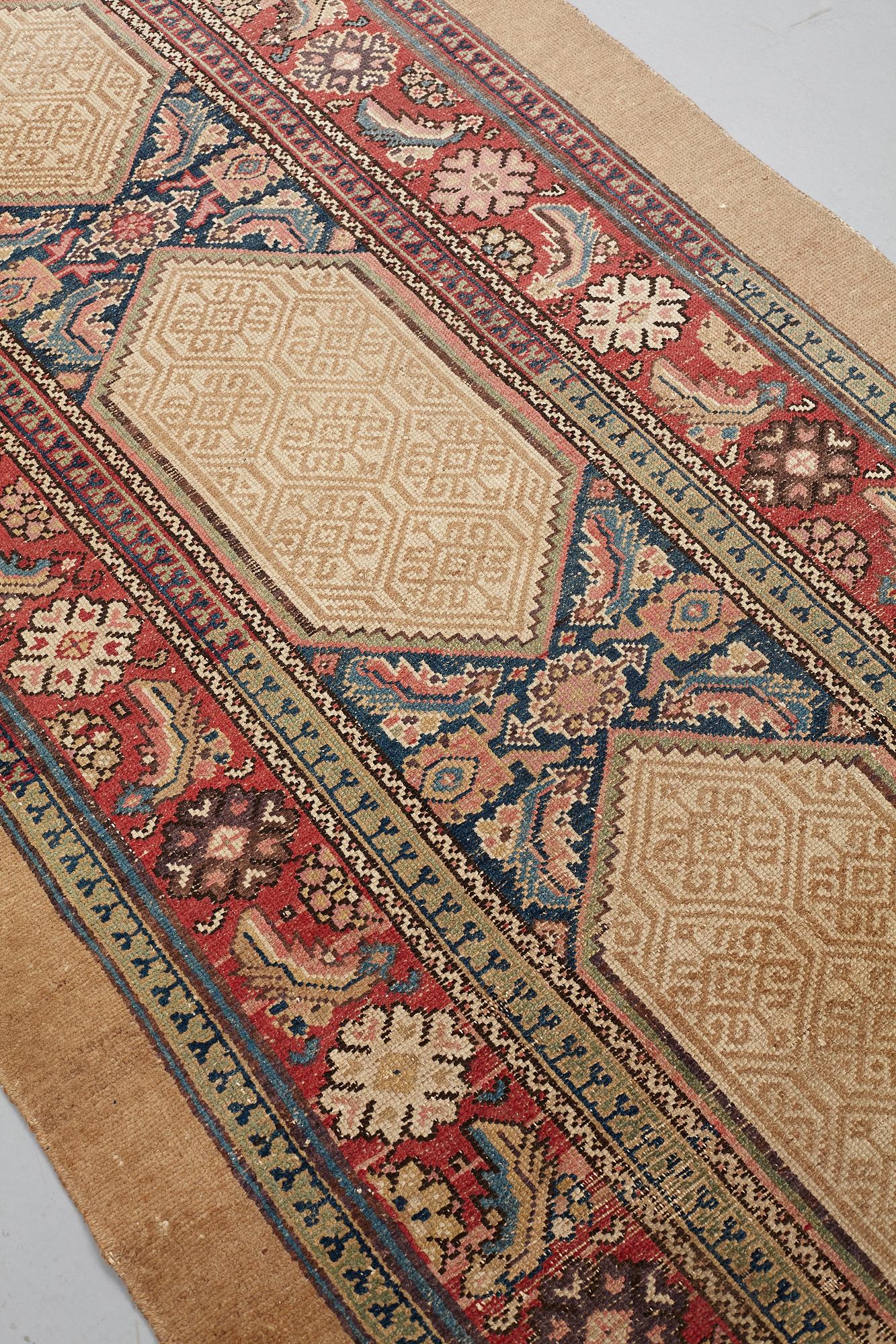MATTO, an antique/semi-antique Hamadan, one of a pair, ca 517,5 x 112,5 cm (as well as 2 cm flat weave at each end).