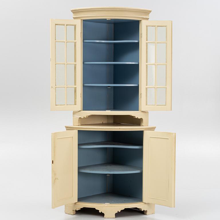 A Gustavian style corner cabinet, first half of the 20th Century.