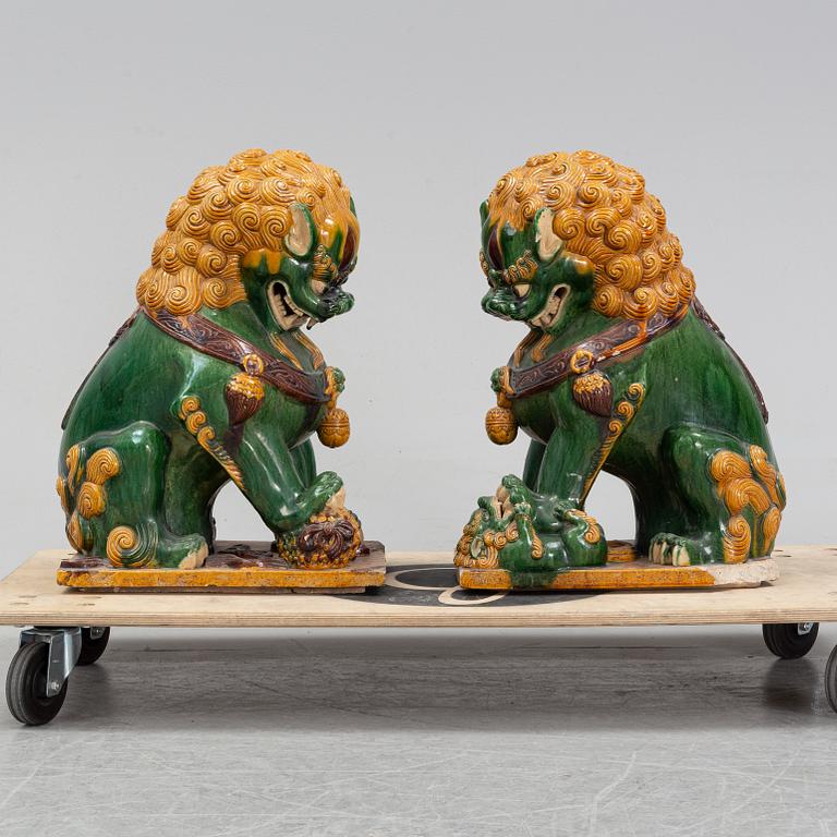 A pair of sancai-glazed chinese buddhist lions or guardian lions, early 20th century.