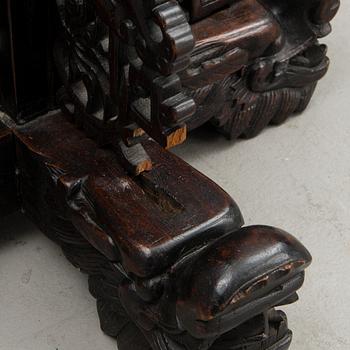 A Chinese carved wood floor lamp from the first half of the 20th Century.