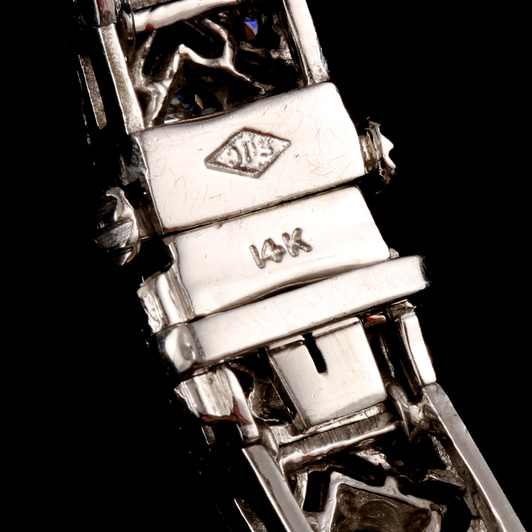 ARMBAND, 14k vitguld med 115 briljantslipade diamanter, totalt ca 5.06 ct. Vikt 29 g.