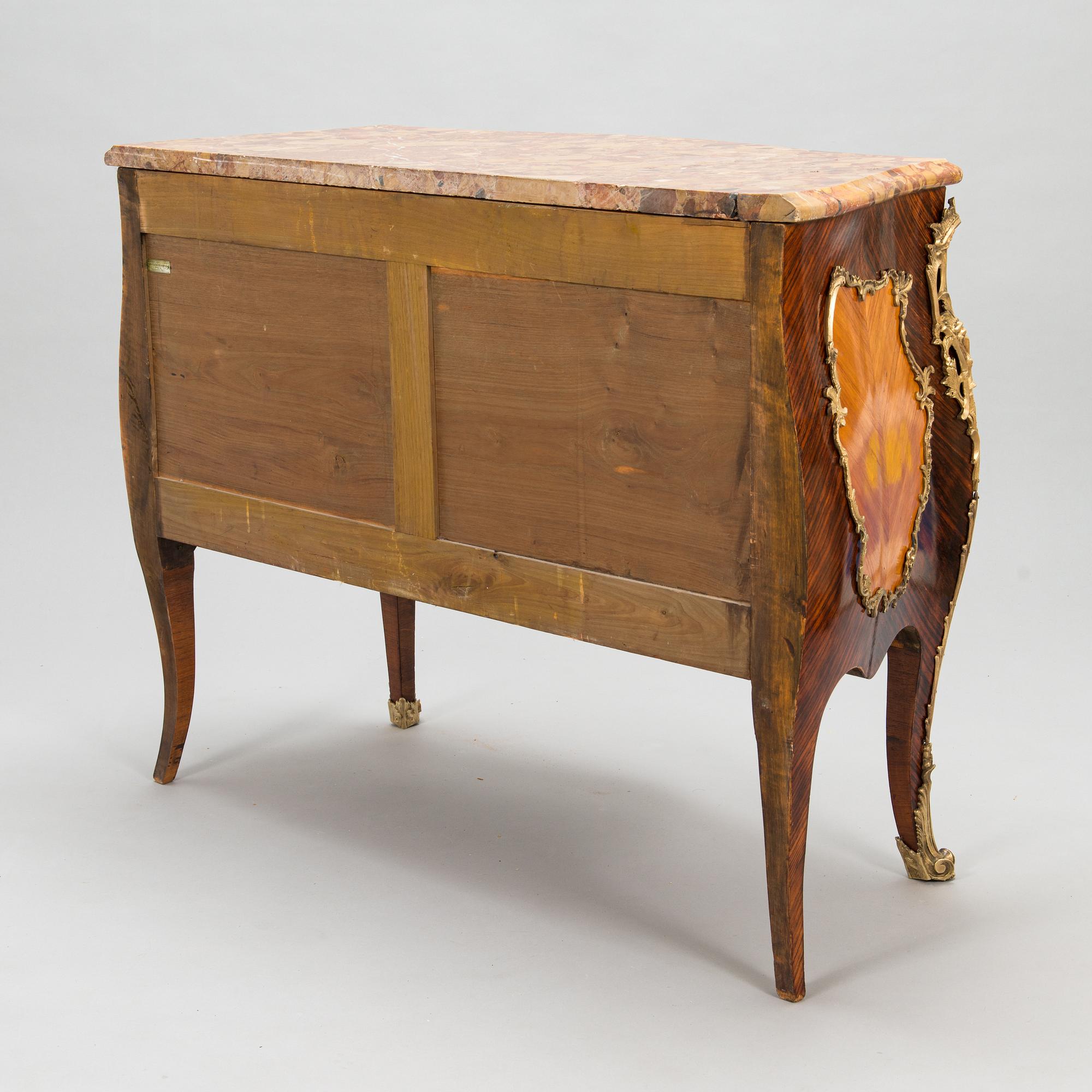 A chest of drawers plaque marked Les fils d'Alfred Wimphen Paris, early 20th century.