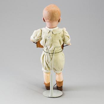 A bisque headed boy doll by Heubach, Germany, 1910s.